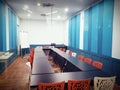 Co working corner open space office with colorful chair,black long tables ,large windows with interior