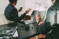 co working meeting,two businessman using VOIP headset with latop computer on desk in modern office as call center and customer se Royalty Free Stock Photo