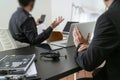 co working meeting,two businessman using VOIP headset with latop computer on desk in modern office as call center and customer se Royalty Free Stock Photo