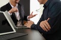 Co working team meeting concept,Man using VOIP headset with digital tablet and latop computer and smart phone in modern office Royalty Free Stock Photo