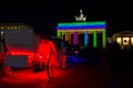 The coach and the Brandenburg Gate in the night li