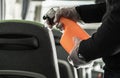 Coach Bus Owner Sanitizing and Cleaning Vehicle Seats Royalty Free Stock Photo
