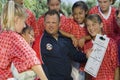 Coach Discussing Strategy With Girls Soccer Team