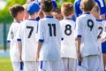 Coach giving young soccer team instructions. Youth soccer team t Royalty Free Stock Photo