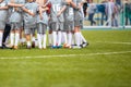 Coach giving young soccer team instructions. Youth soccer team