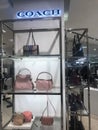 Coach handbags displayed in a shopping mall, London