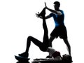 Coach man woman exercising abdominals with bosu silhouette Royalty Free Stock Photo