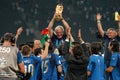 Italy coach Marcello Lippi raises the world cup