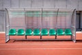 Coach and reserve benches in soccer stadium Royalty Free Stock Photo