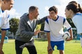 Coach talking to young soccer team before the match Royalty Free Stock Photo