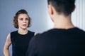 Coach teaches athlete to hit kick. Strong female martial arts athletes in their taekwon-do training. Two young women instructor Royalty Free Stock Photo