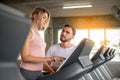 Coach teaches correct using treadmill
