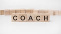 COACH word, text, written on wooden cubes, building blocks, over white background Royalty Free Stock Photo