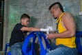 Muay thai fighter swathing hand in boxing bandage