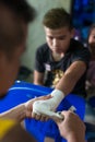 Muay thai fighter swathing hand in boxing bandage