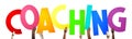 Coaching - human hands holding colorful letters Royalty Free Stock Photo