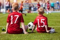 Coaching Kids Soccer. Young Boys Sitting on Football Field. Football Match for Children