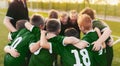 Coaching Youth Sports. Group Of Children In Soccer Team. School Football CoachÃ¢â¬â¢s Pregame Speech. Young Boys United In Football Royalty Free Stock Photo