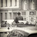 Coachman and horse carriage in the middle of traffic in city center of Prague