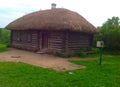 Coachman`s hut - a wooden hut with a roof of straw Royalty Free Stock Photo