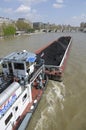 Coal barge and tug boat on the Seine River, Paris, ÃÅ½le-de-France Royalty Free Stock Photo