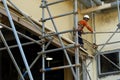 Coal Fired Power Plant Project. Scaffolder installing scaffolding on the building