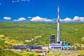 Coal fossil fuel power plant in green Plomin valley and highest croatian chimney view