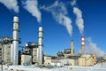 Coal Fossil Fuel Power Plant Smokestacks Emit Carbon Dioxide Pollution On A Cold Snowy Day