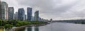 Coal Harbor in Vancouver British Columbia with downtown buildings boats and reflections in the water Royalty Free Stock Photo