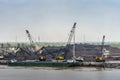 Coal hills along Long Tau River, Phuoc Khanh, Vietnam