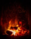 Coal and logs burning fire Royalty Free Stock Photo