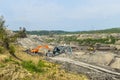 Coal mine accident with a heavy extraction machine inside the coal exploitation. The huge excavator collapsed in the open pit.