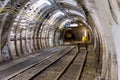 Coal mine tunnel with rail tracks Royalty Free Stock Photo