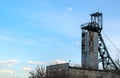 Coal mine with wheels. Colliery against the blue sky Royalty Free Stock Photo