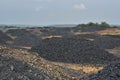 Coal piled up in mining field coal heaps stockpile Royalty Free Stock Photo