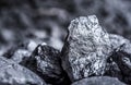 Coal mining industry. Natural black coals for background. Coal in the miner hands. Volcanic rock.