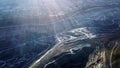 Coal mining at an open pit. Top view of the quarry. Dozers and trucks at buildings site on top aerial view