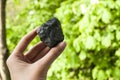 Coal. Natural crystal without processing on a green background. Place for text Royalty Free Stock Photo