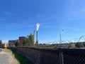 Coal power plant with smoke billowing from it's pipes