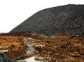 Coal waste heap, terricone, isolated on white Royalty Free Stock Photo