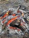 Coals burning red in the outdoor fire