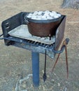 Coals on the Lid of a Dutch Oven Cooking Dinner Royalty Free Stock Photo