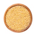 Coarse bulgur, burghul, cracked and parboiled wheat, in a wooden bowl