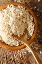 Coarse crumbs Panko breading ingredient in a bowl, close-up. Vertical top view Royalty Free Stock Photo