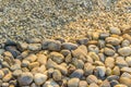 Coarse and fine river gravels for background. Big and small river pebbles texture background.