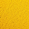 Coarse, granular yellow sand; uneven, sun baked texture, fine, texture Royalty Free Stock Photo