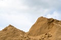 Coarse Sand Pile with cloudy sky.