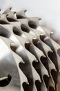 Coarse teeth of carbide-tipped saw blades for close-up cutting of wood Royalty Free Stock Photo