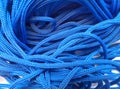 Coarse textured blue ropes with irregular and chaotic windings or turns