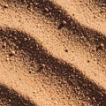 Coarse, textured sand with distinct, small ridges casting shadows across its surface. Royalty Free Stock Photo